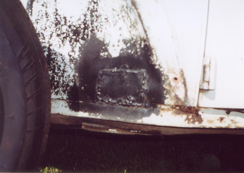 lh behind front wheel rust.jpg